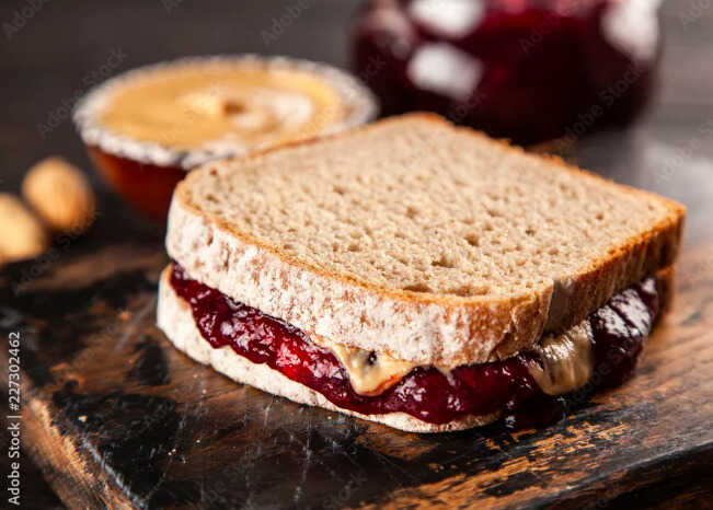 Sandwich de manteqilla de manpi y mermelada Atril press